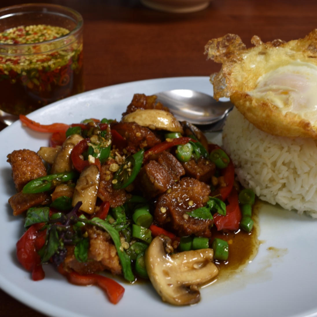 This Thai favorite is the crispy pork and holy basil rice dish. The fried egg is extra, but well worth it.